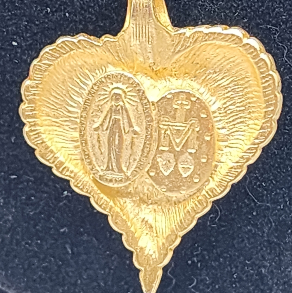 Gold tone sacred heart necklace